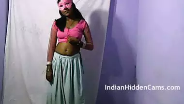 Indian masked aunty doing striptease.