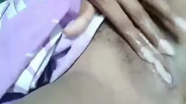 Girl masturbates and fingers her own pussy in the Desi amateur video