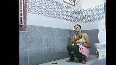 Mysterious Indian woman in purple mask washes nice body on camera