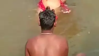XXX video of Desi girl who flirts with a bunch of guys in a river